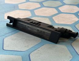 Плафон освещения номерного знака для Opel Astra H (2004-2015)  запчасти бу